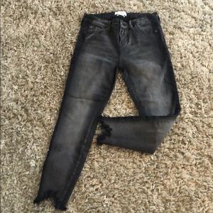 Distressed black denim jeans